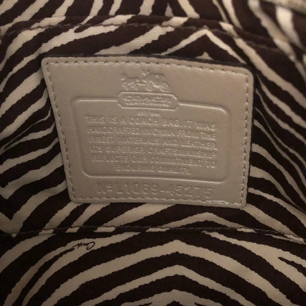 Coach straw snake embossed turn lock wristlet clutch purse